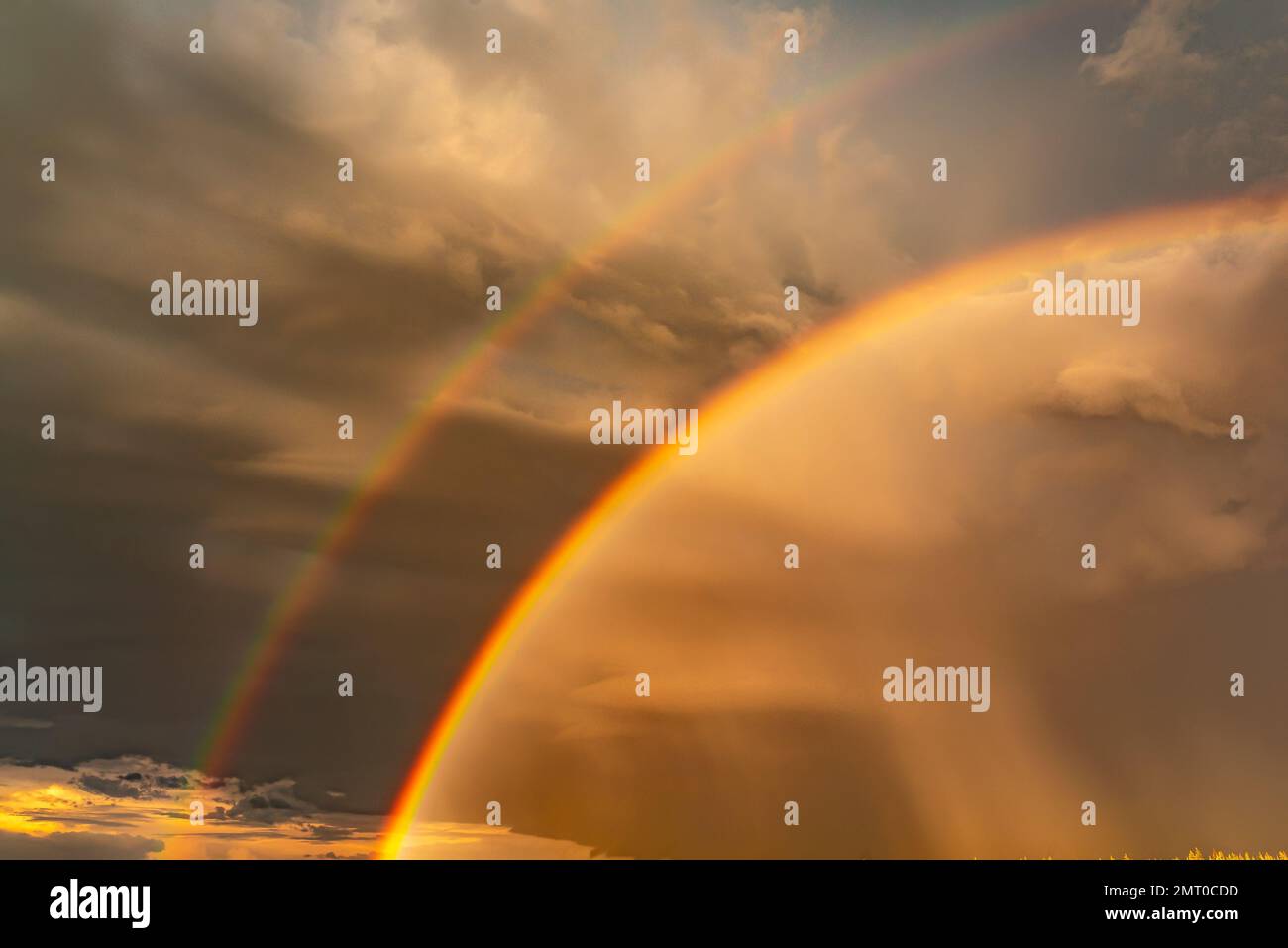 Double rainbow against a blue sky and white clouds after rain Stock ...