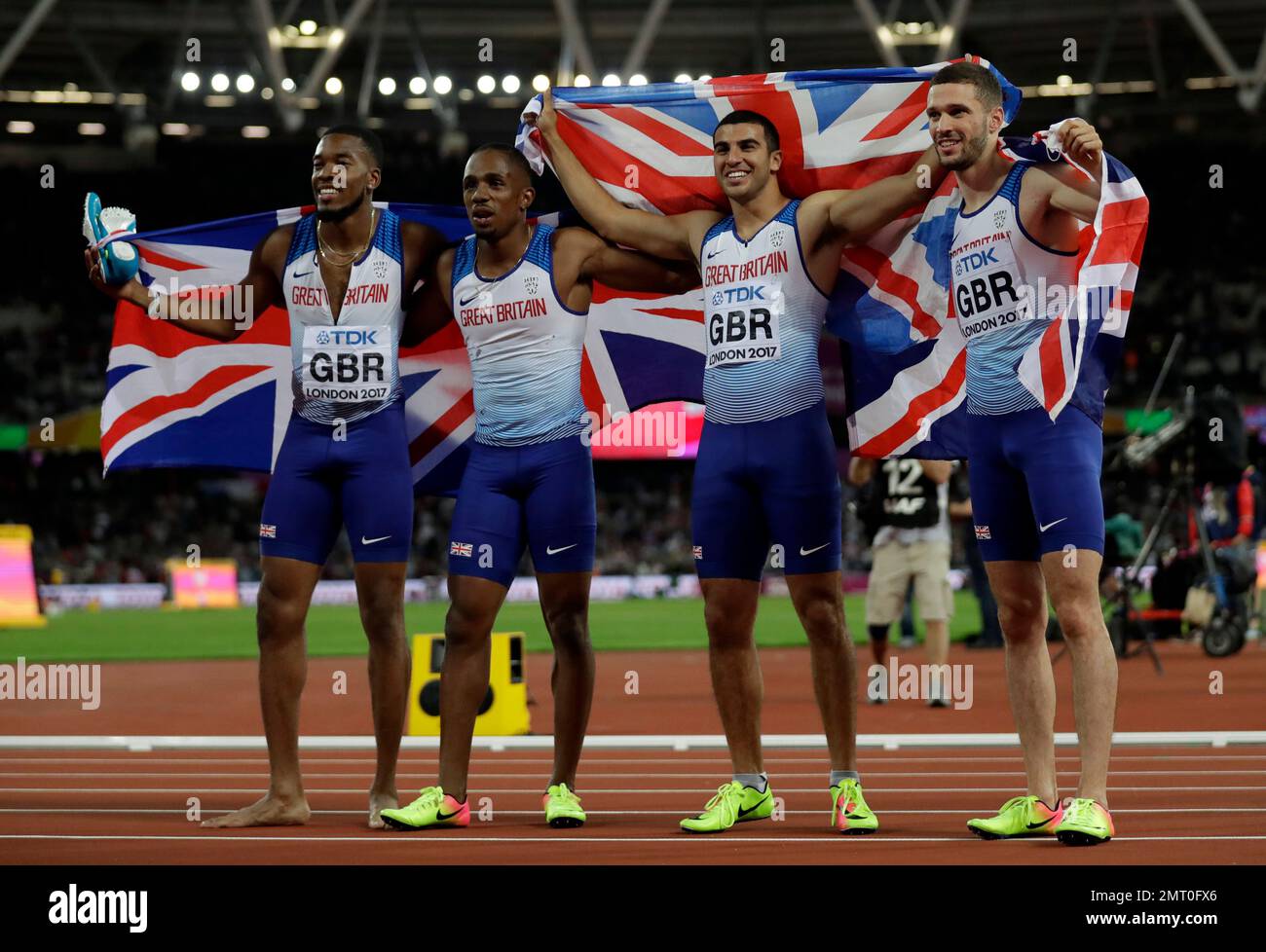 The gold medal winning British team pose for a photo after the men