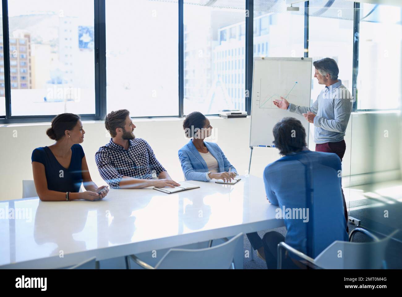Leading his team with expertise. A businessman doing a presentation