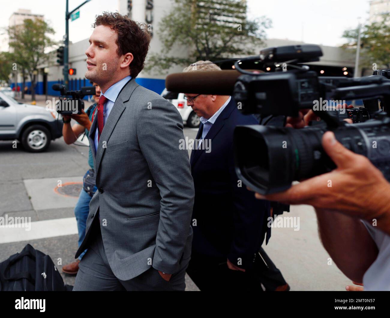 Austin Swift, brother of pop singer Taylor Swift, heads to a hotel after  emerging from the federal courthouse following a ruling in the civil trial  for Taylor Swift to determine whether a