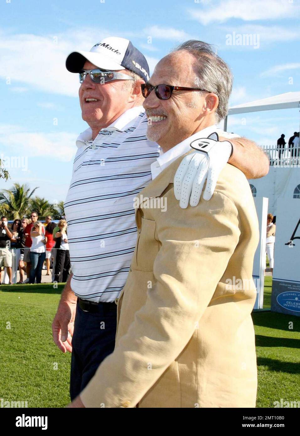 Exclusive!! James Caan plays on day three of The Michael Jordan Celebrity Invitational golf tournament held at the luxurious One and Only Ocean Club Golf Course on Paradise Island. At one point, Young hit one into the rough which, in this case, was the beach on the other side of a wall! He worked very hard to get it back onto the course. At least it didn't end up in the ocean. The MJCI organization brings in an incredible array of talent from the worlds of sport and entertainment to compete on the course and participate in various events for charity in this annual event.  In it's seventh year Stock Photo