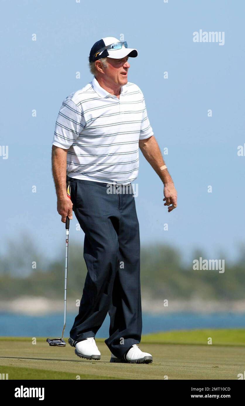Exclusive!! James Caan plays on day three of The Michael Jordan Celebrity Invitational golf tournament held at the luxurious One and Only Ocean Club Golf Course on Paradise Island. At one point, Young hit one into the rough which, in this case, was the beach on the other side of a wall! He worked very hard to get it back onto the course. At least it didn't end up in the ocean. The MJCI organization brings in an incredible array of talent from the worlds of sport and entertainment to compete on the course and participate in various events for charity in this annual event.  In it's seventh year Stock Photo