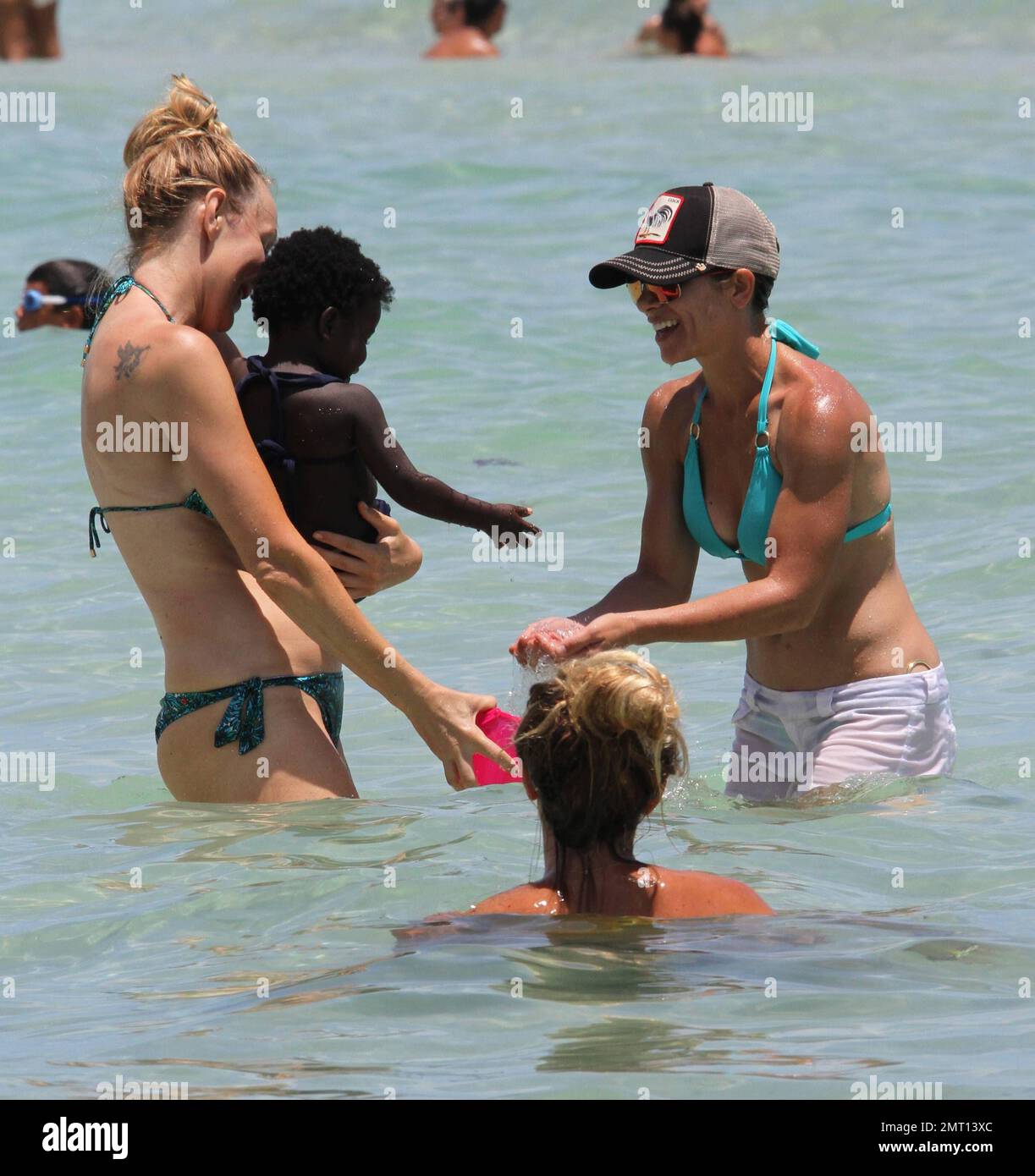 Jillian Michaels and her daughter, Lukensia enjoy the surf on Miami Beach  during Veteren's Day Featuring