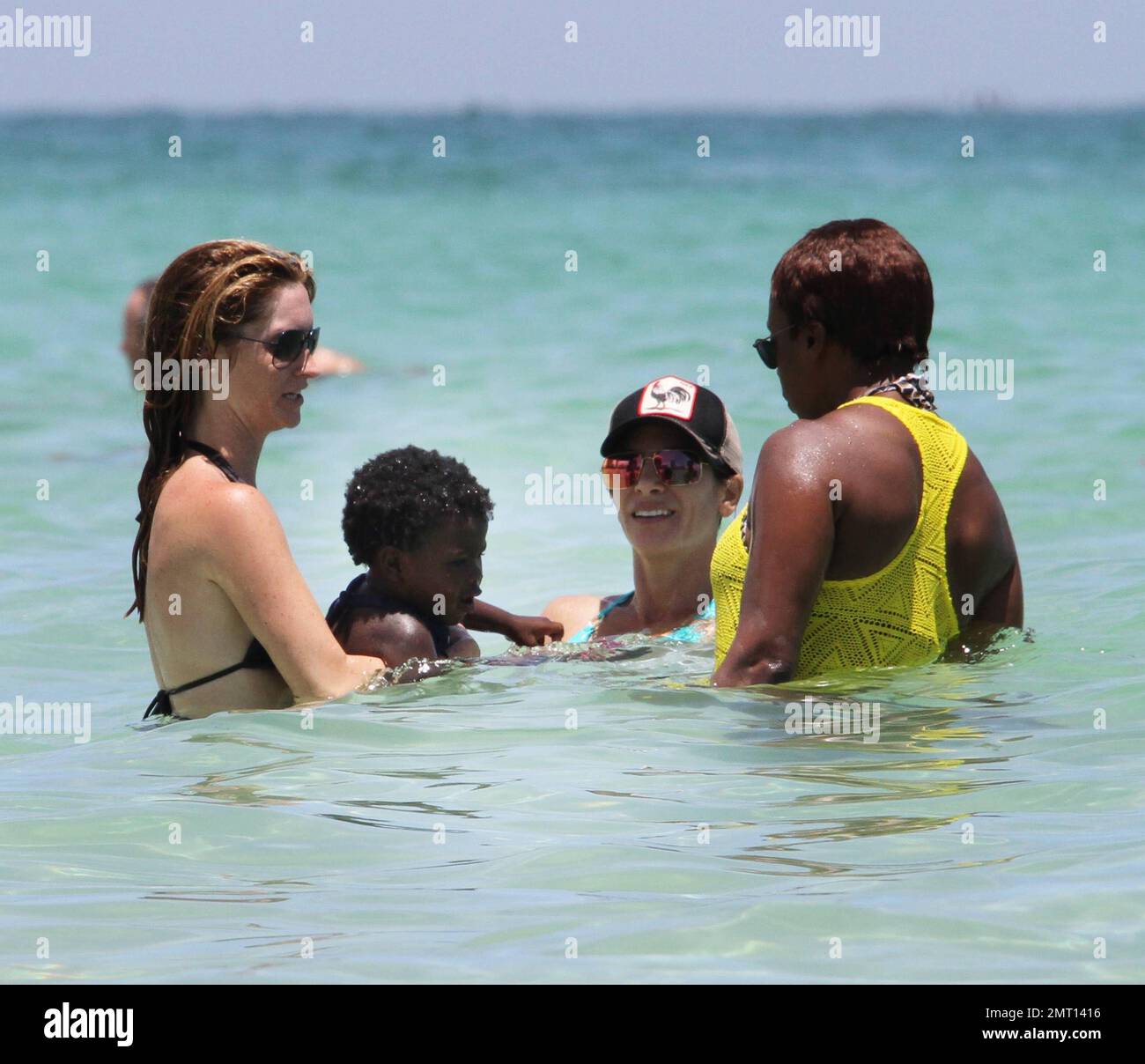 Jillian Michaels and her daughter, Lukensia enjoy the surf on Miami Beach  during Veteren's Day Featuring