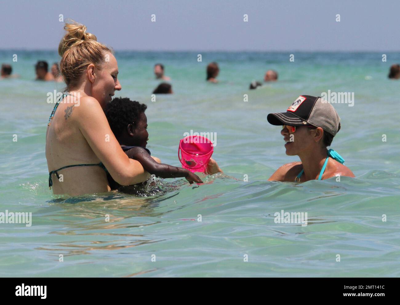 Jillian Michaels and her daughter, Lukensia enjoy the surf on Miami Beach  during Veteren's Day Featuring