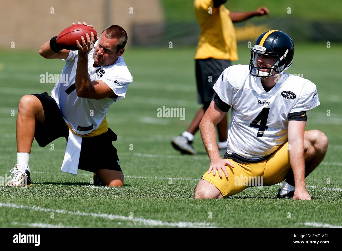 Pittsburgh Steelers quarterback Ben Roethlisberger (7) takes long snaps beside punter Jordan Berry (4) for placekicking drills during an NFL training camp football practice, Wednesday, Aug. 9, 2017, in Latrobe, Pa. (AP Photo/Keith Srakocic) Stock Photo