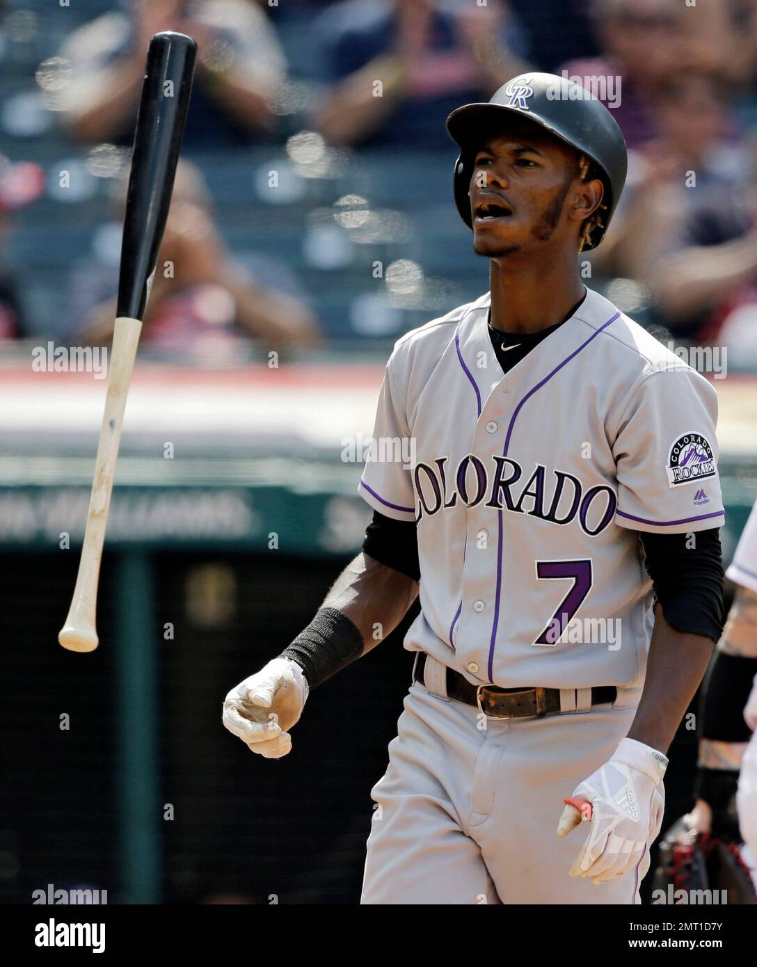 Raimel Tapia of the Colorado Rockies loses his helmet while