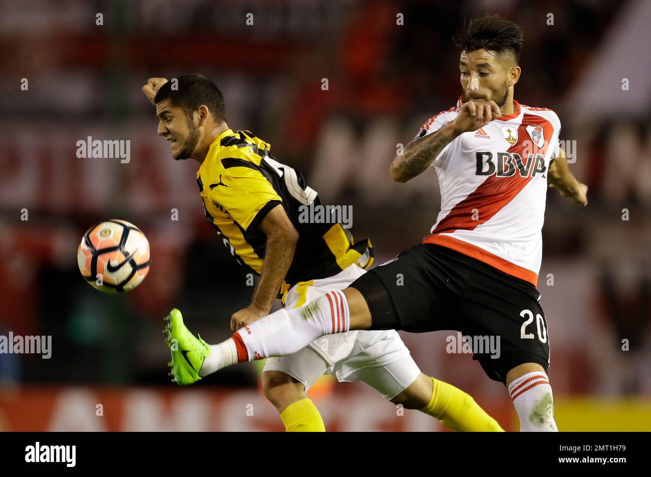 Rafinha of Brazil's Flamengo heads the ball challenged by Milton Casco of  Argentina's River Plate during the Copa Libertadores final soccer match at  the Monumental stadium in Lima, Peru, Saturday, Nov. 23