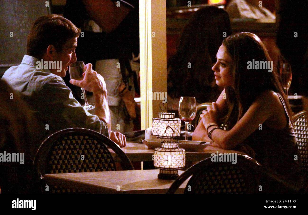 EXCLUSIVE!! Mila Kunis films an seemingly romantic scene at a small restaurant for her new film