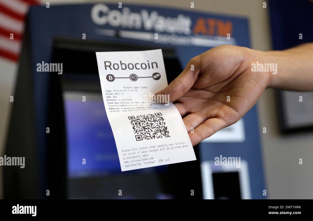 FILE- This Wednesday, Aug. 20, 2014, file photo, shows a receipt with a QR  code after a transaction was made at a bitcoin machine, in Austin, Texas.  Bitcoin, the digital currency, is