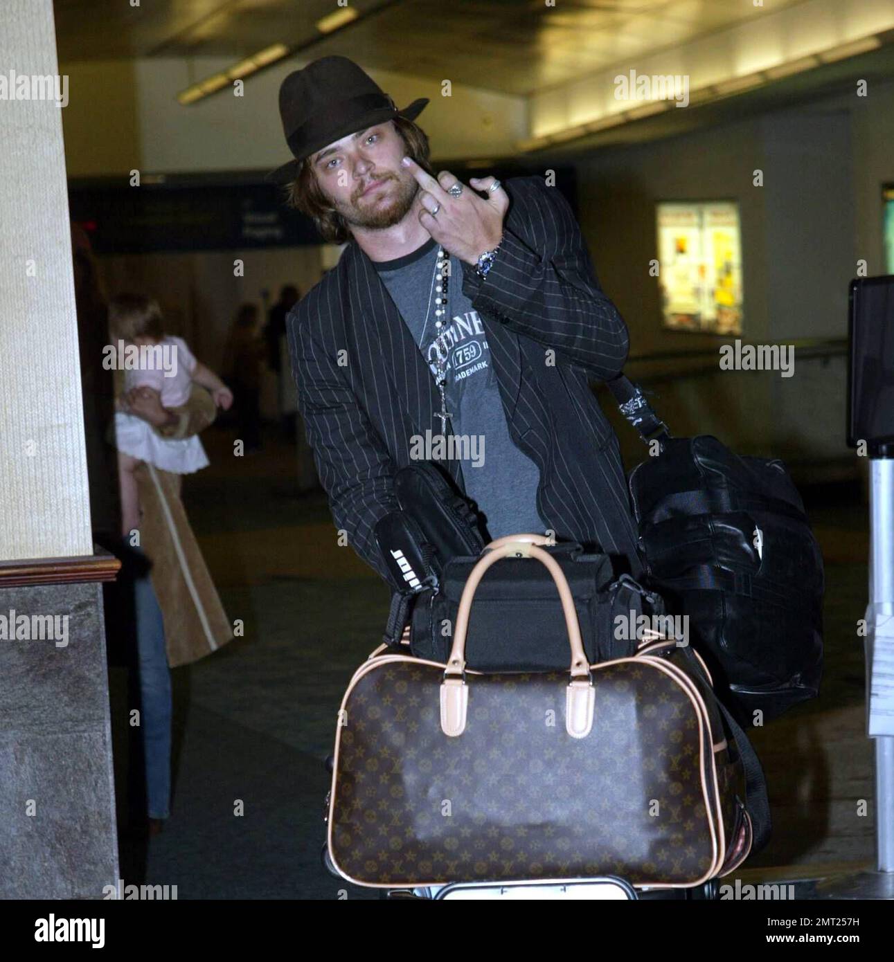 Exclusive!! Mira Sorvino's husband Chris Backus lets his fingers do the