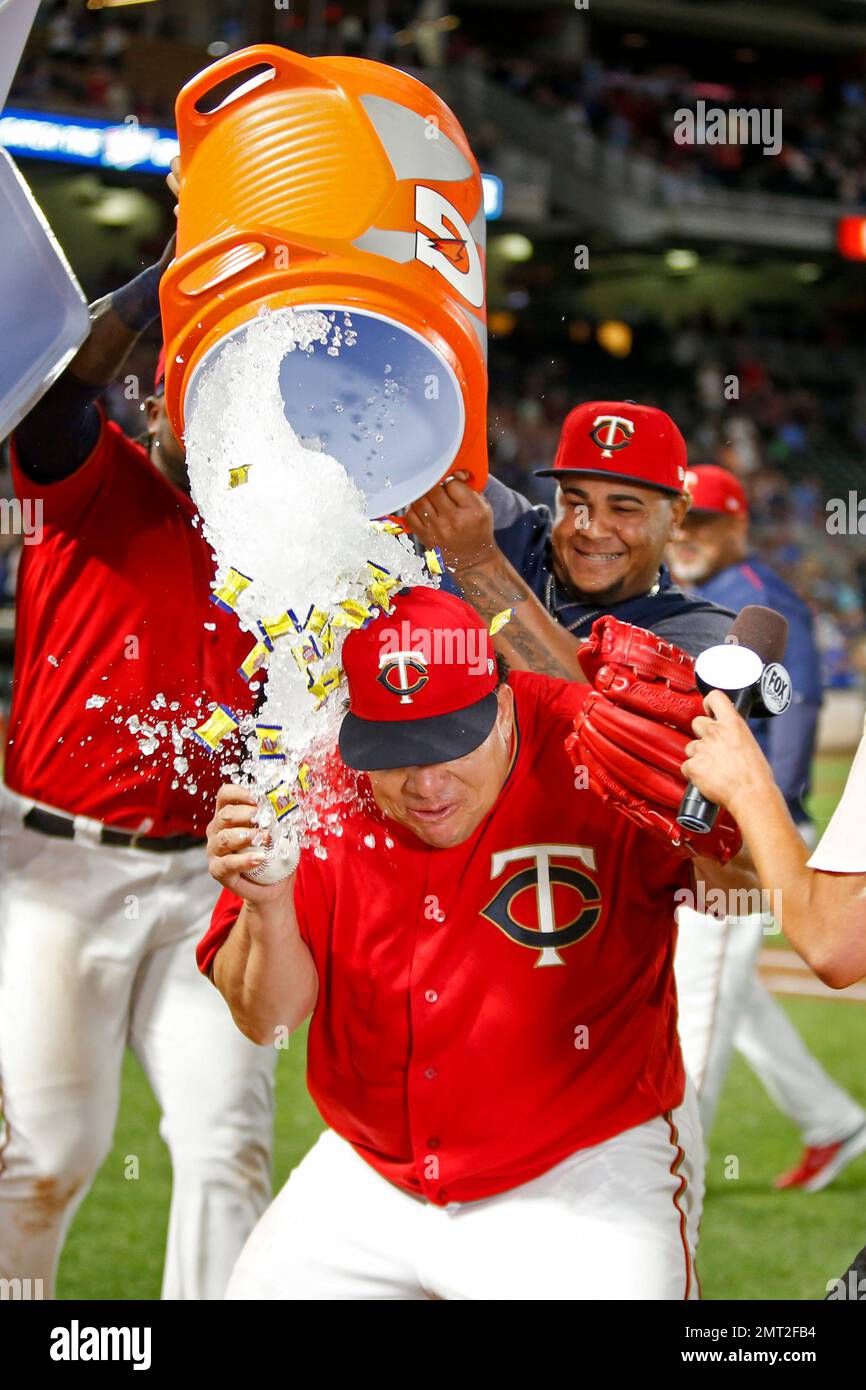 Minnesota Twins starting pitcher Bartolo Colon is doused by Adalberto Mejia  and other teammates after throwing a complete baseball game against the  Texas Rangers at a baseball game Friday, Aug. 4, 2017