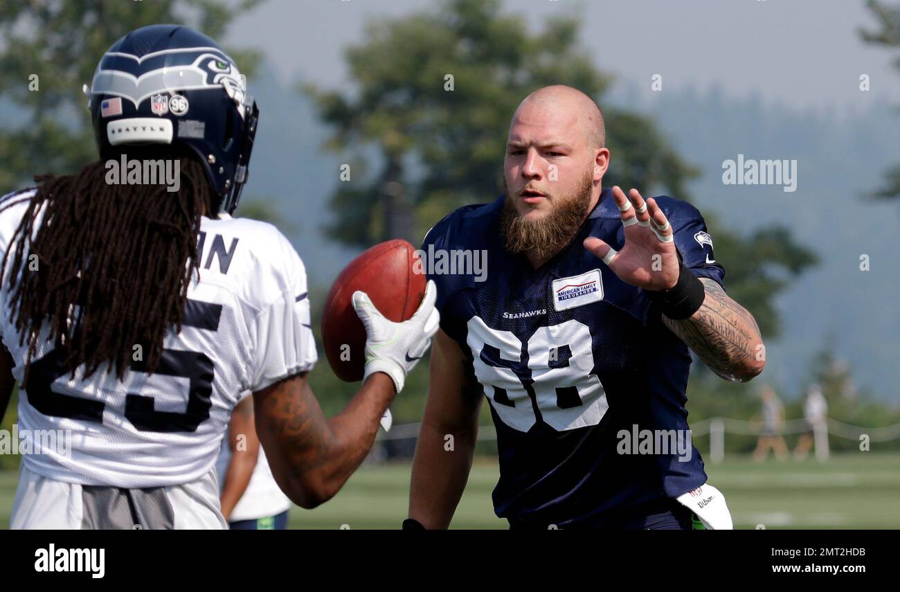 Seattle Seahawks' Justin Britt (68) greets Richard Sherman during an ...