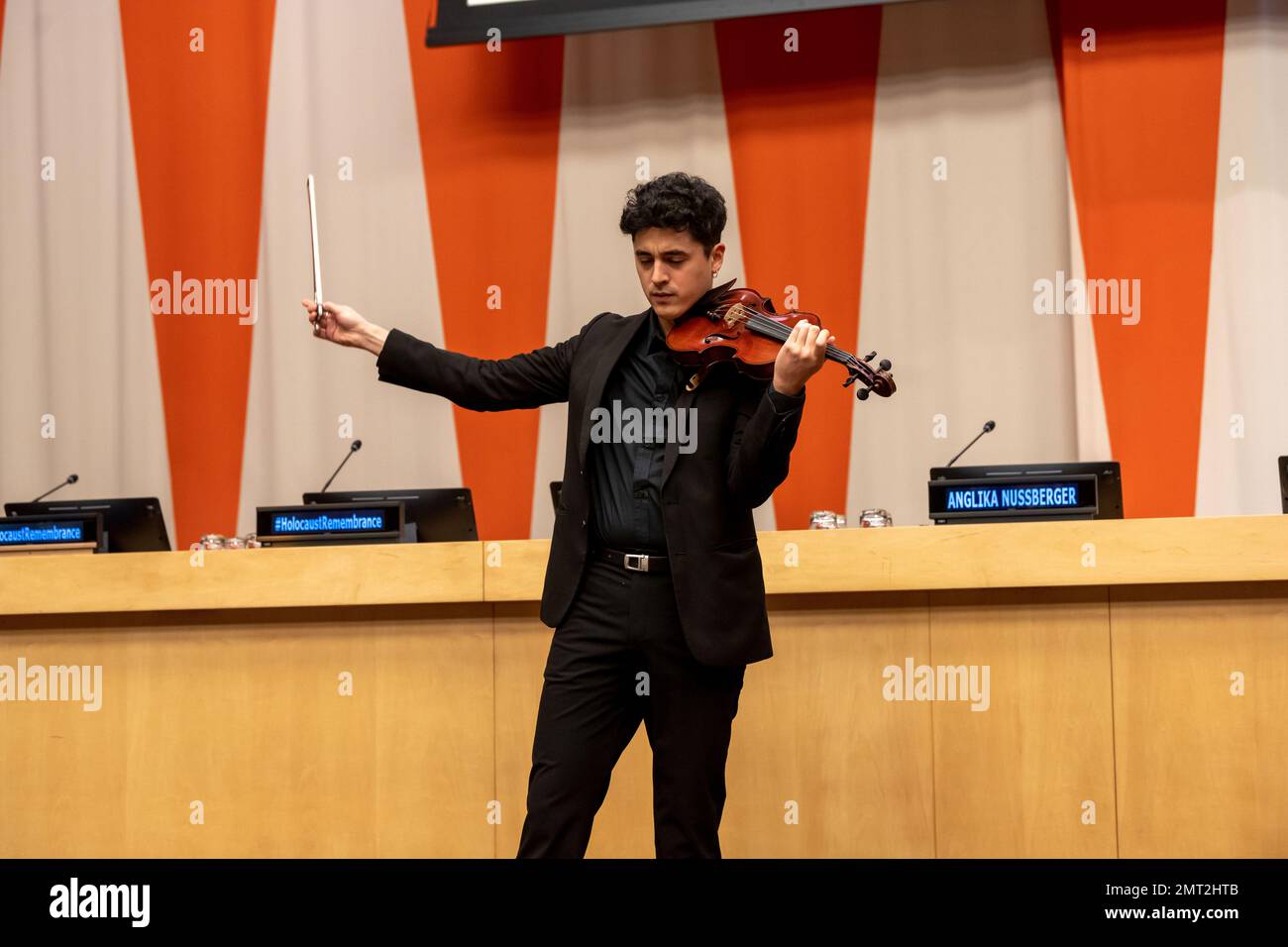 NEW YORK, NEW YORK - JANUARY 31: Brian Urra plays the violin at a special event 'International Mock Trial on Human Rights' on the occasion of the International Day of Commemoration in Memory of the Victims of the Holocaust (27 Jan) at the New York United Nations Headquarters on January 31, 2023 in New York City.    The participants, student from several countries, interrogate the actions and responsibilities of Ernst Rüdin, the so-called father of Nazi Racial Hygiene. Stock Photo