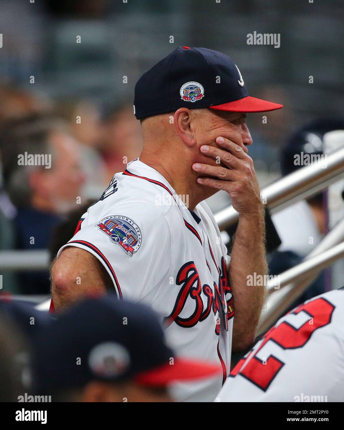 Atlanta Braves manager Brian Snitker watches from the dugout during the  team's baseball game against the