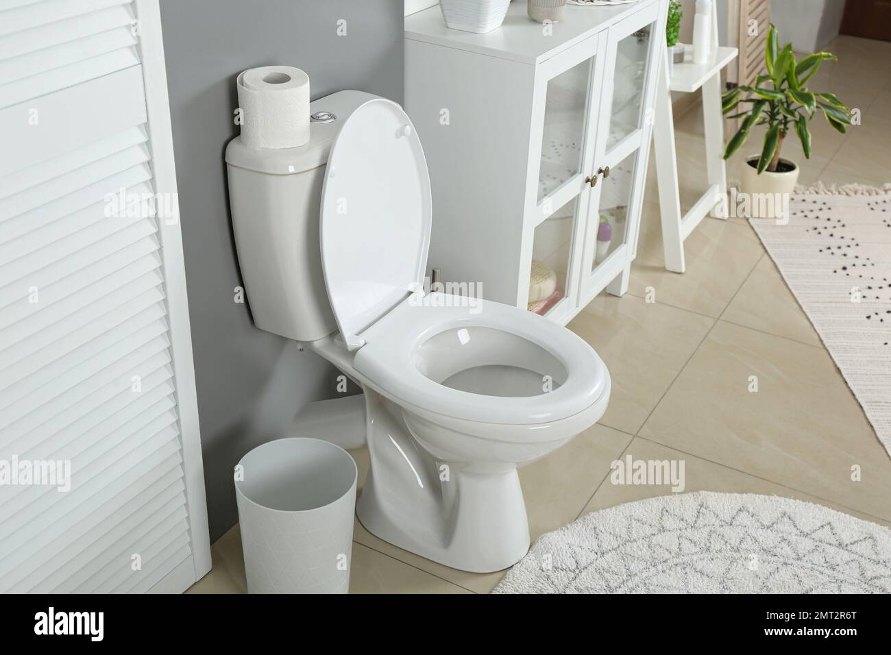 Stylish toilet bowl in modern bathroom interior Stock Photo - Alamy