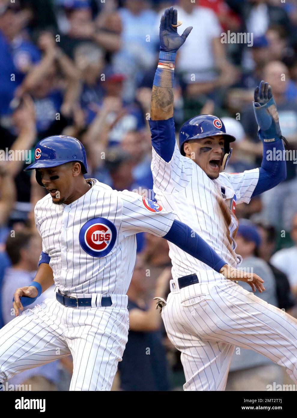 Chicago Cubs' Jon Jay, left, and Javier Baez celebrate after