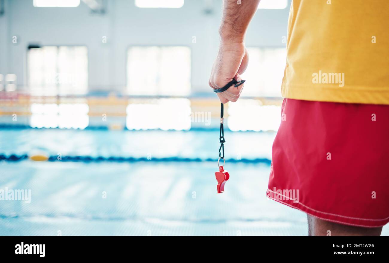 Hands, lifeguard and whistle by swimming pool for water safety