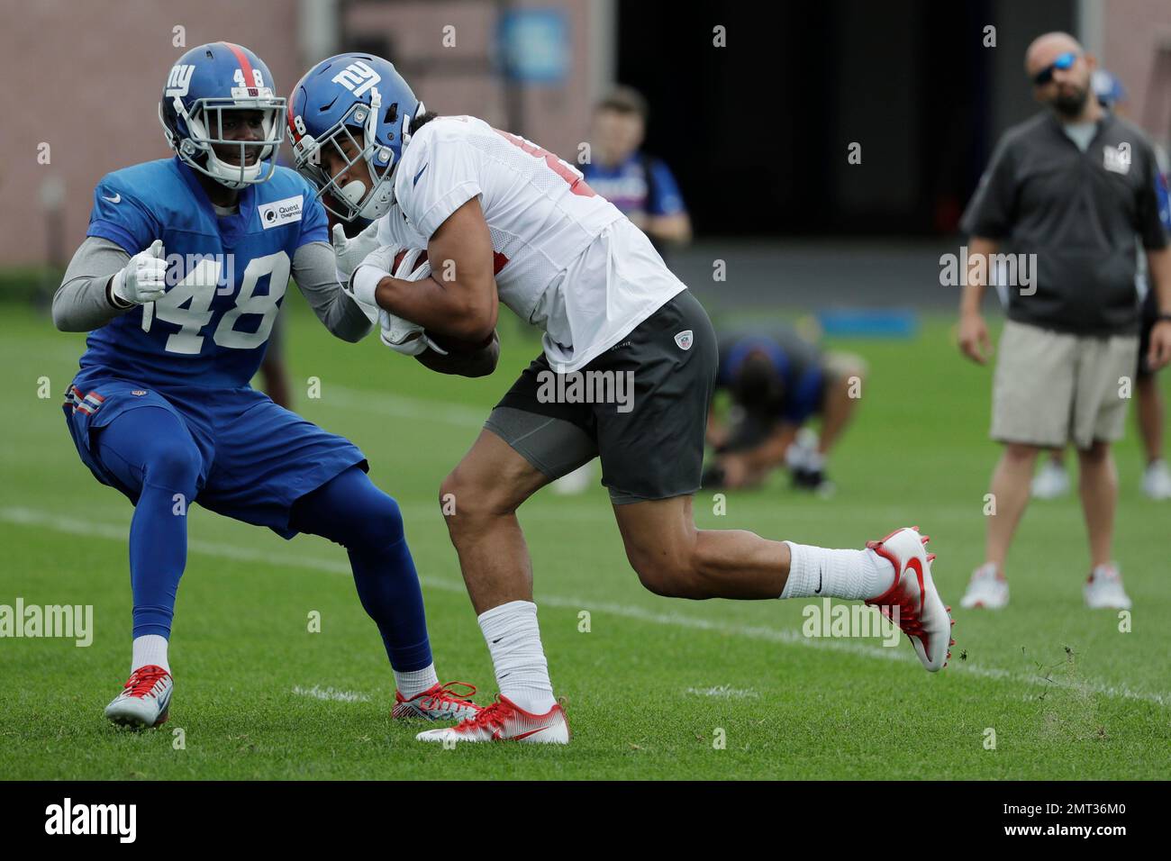 New York Giants Tight End Evan Engram, Right, Runs A Drill With Safety ...