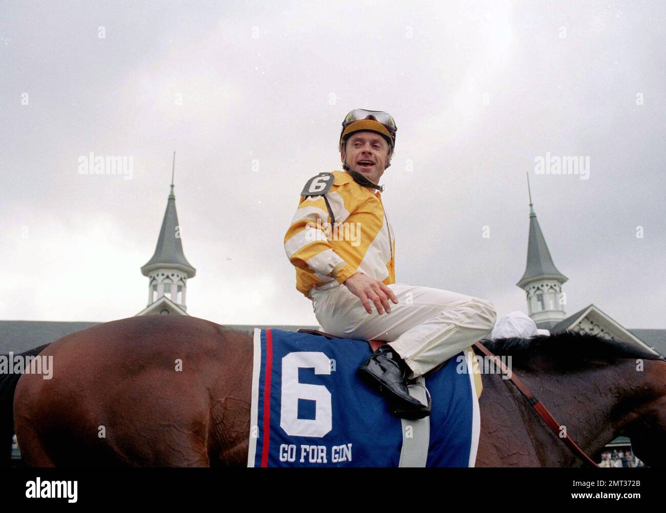 Jockey Chris McCarron aboard Go For Gin, is all smiles as he heads to