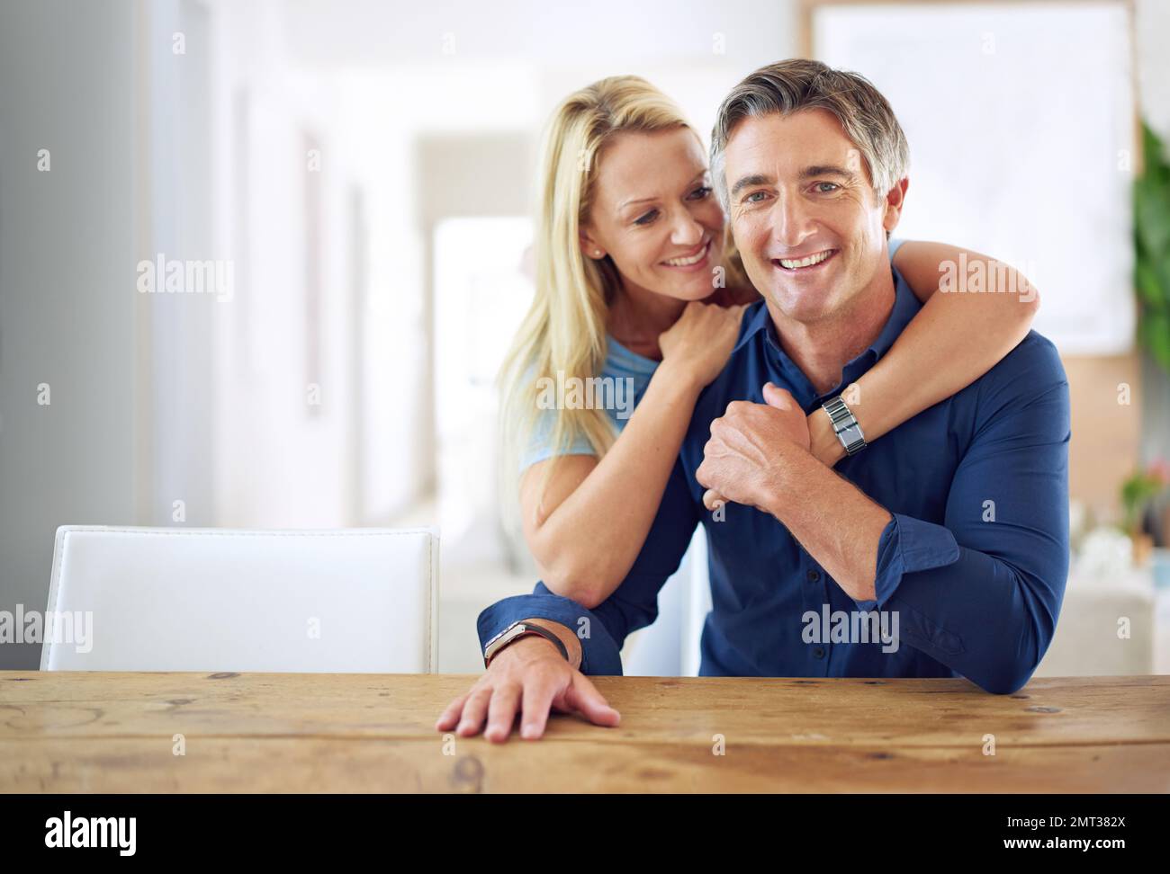 Our home is our hearth. Portrait of an affectionate mature couple at home. Stock Photo