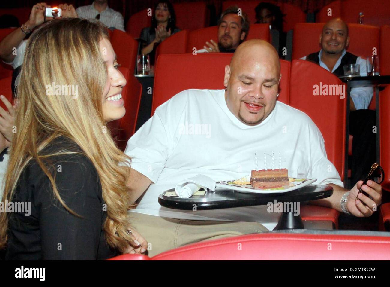 Mr. 305 Pitbull holds a VIP listening session at Cinebistro for his upcoming album, 'Revolution.' As part of the event, he also surpised rapper Fat Joe with cake in celebration of his birthday. Miami, FL. 8/19/09. Stock Photo