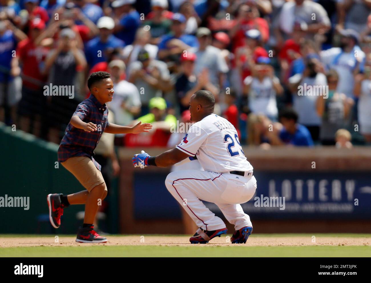 Adrian Beltre Jr., left, runs up to his father Texas Rangers
