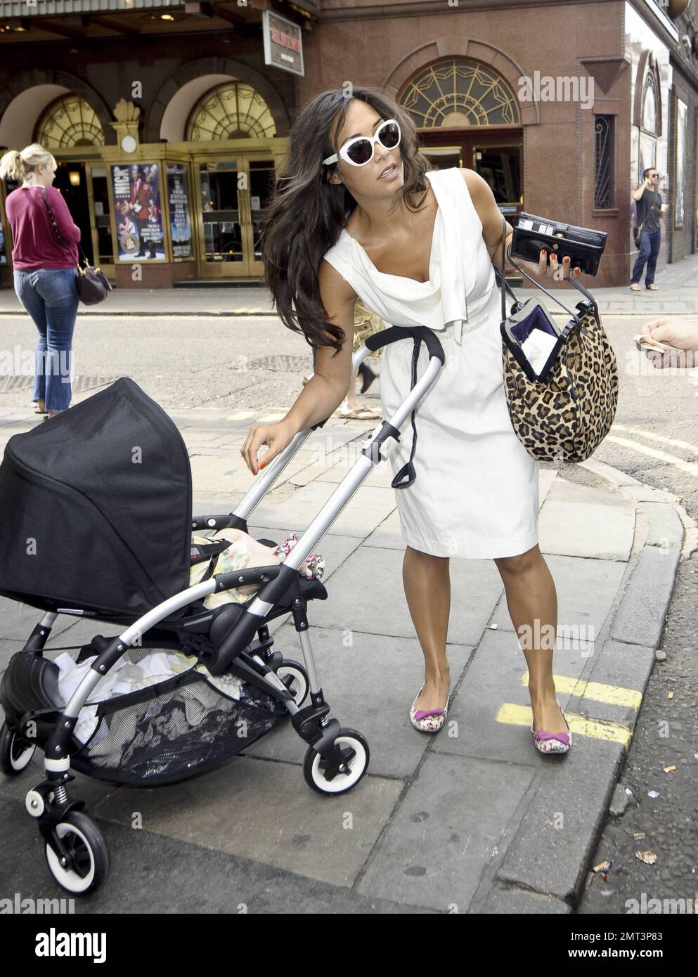 Myleene Klass and her baby wear matching shoes as they head out for a day  in London, UK. 5th August 2011 Stock Photo - Alamy