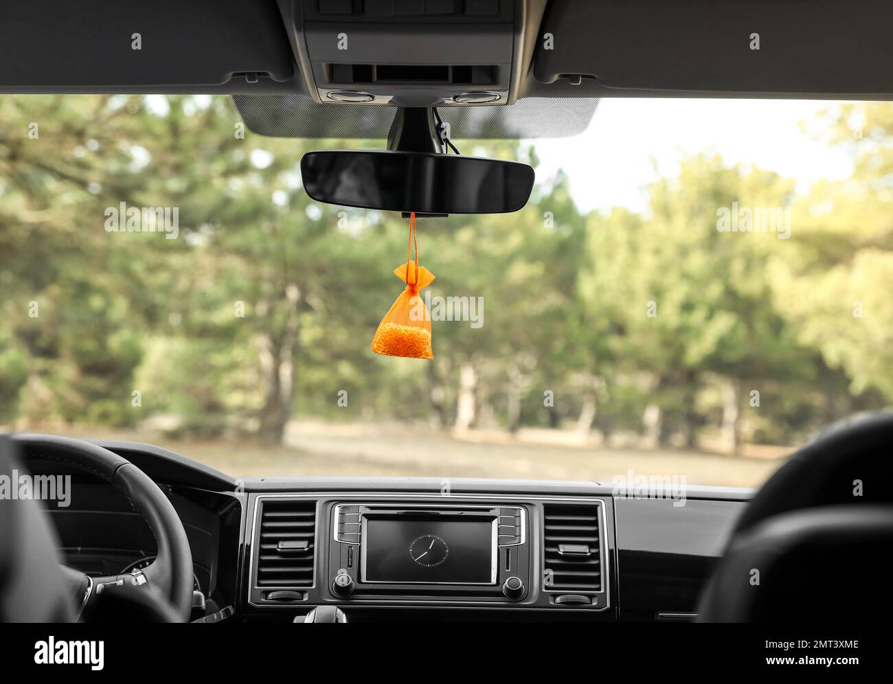 Air freshener hanging on rear view mirror in car Stock Photo Alamy