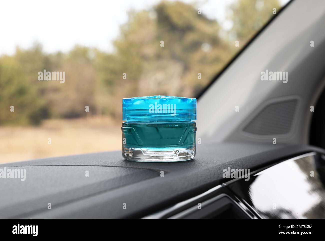 Stylish air freshener on dashboard in car Stock Photo Alamy
