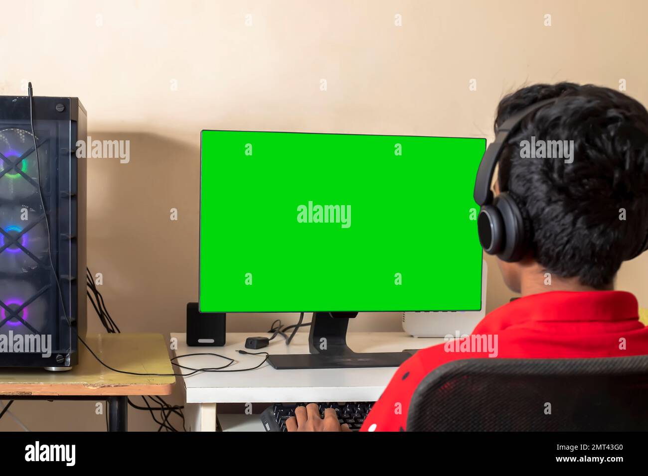 A gamer playing online video game on his powerful personal computer