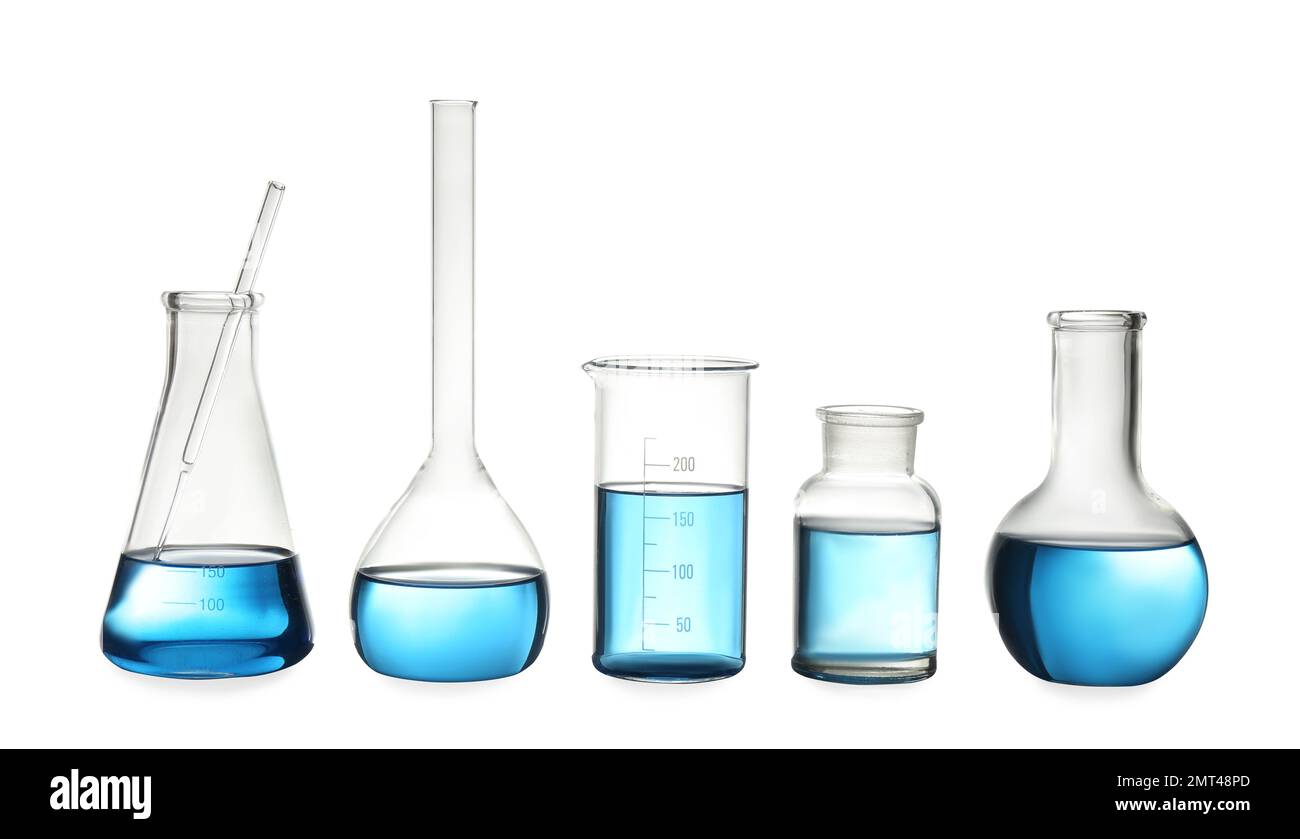 Different laboratory glassware with light blue liquid isolated on white