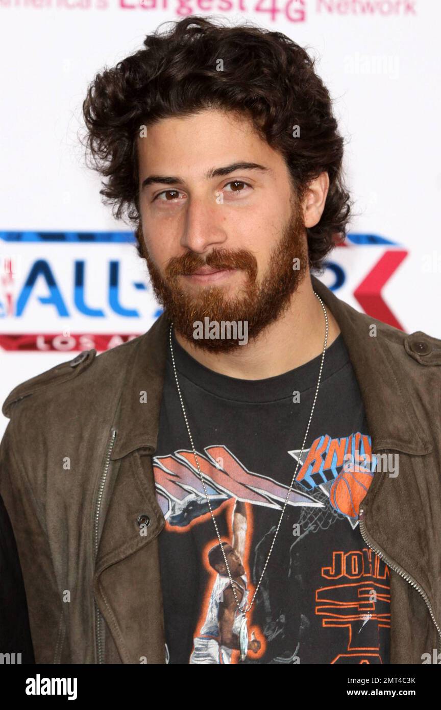 Jake Hoffman poses for photographers on the pink carpet ahead of the