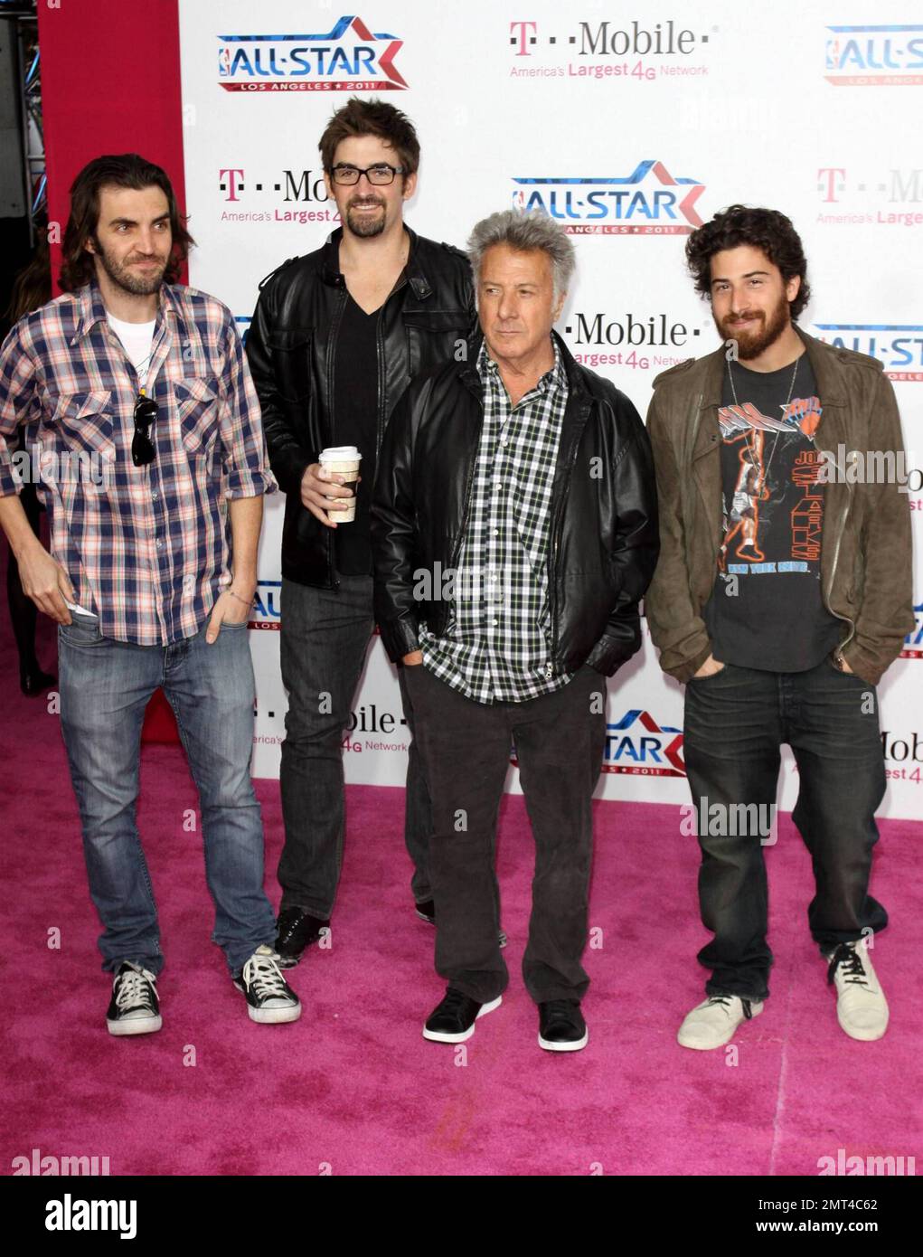 Dustin Hoffman and his son Jake (R) pose for photographers on the pink
