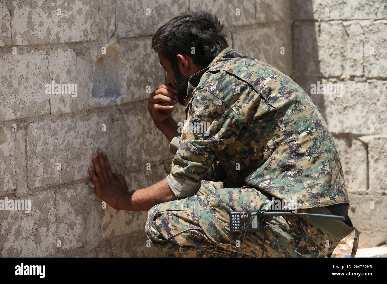 A Us Backed Syrian Democratic Forces Fighter Looks Through A Hole On The Front Line Of The 7571