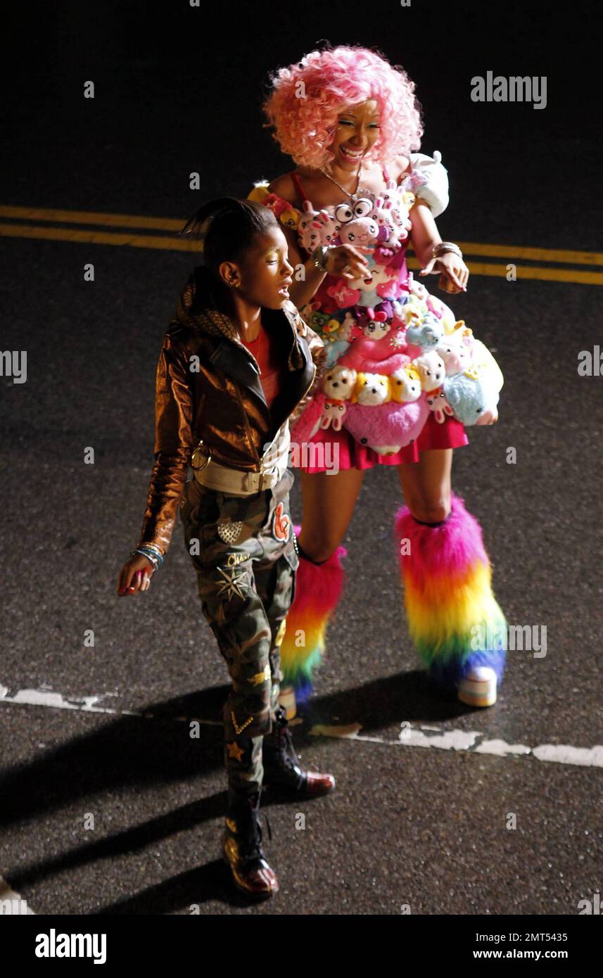 Wearing a pink wig, a stuffed animal-covered dress and rainbow-colored  fuzzy leg warmers, singer Nicki Minaj shoots a new music video on location  in downtown LA. Special guest stars Willow and Jaden