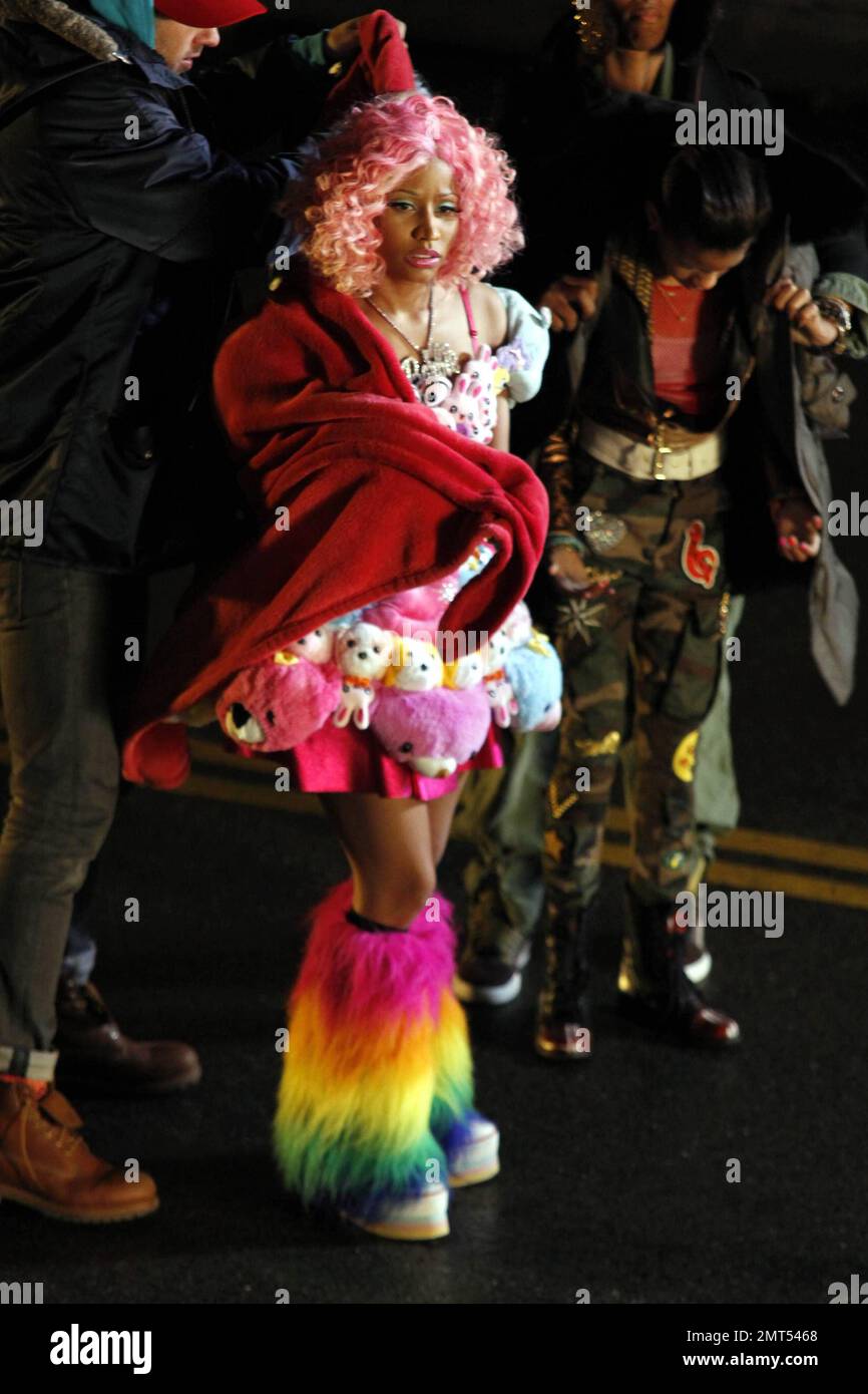 Wearing a pink wig, a stuffed animal-covered dress and rainbow-colored  fuzzy leg warmers, singer Nicki Minaj shoots a new music video on location  in downtown LA. Special guest stars Willow and Jaden