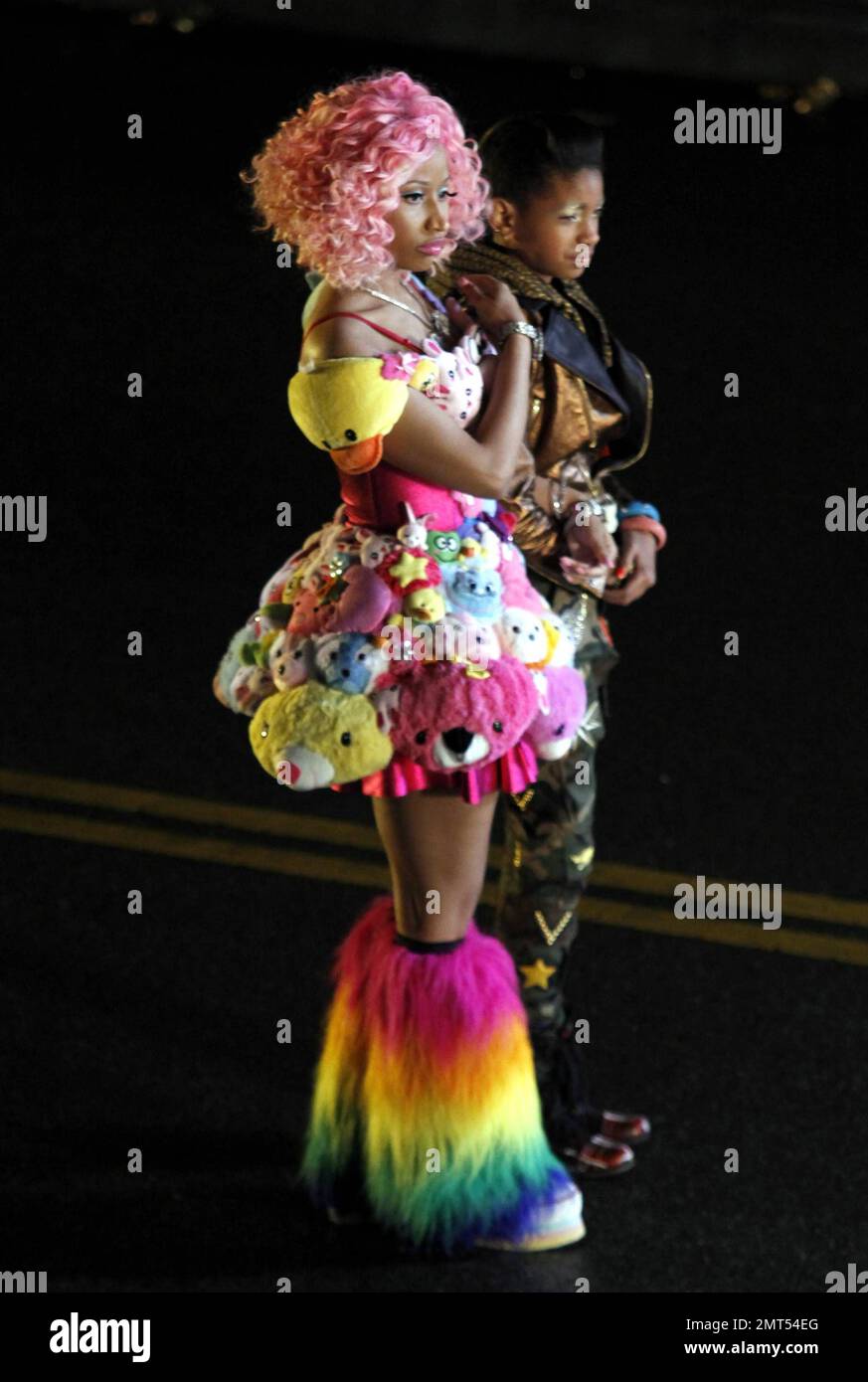 Wearing a pink wig, a stuffed animal-covered dress and rainbow-colored  fuzzy leg warmers, singer Nicki Minaj shoots a new music video on location  in downtown LA. Special guest stars Willow and Jaden