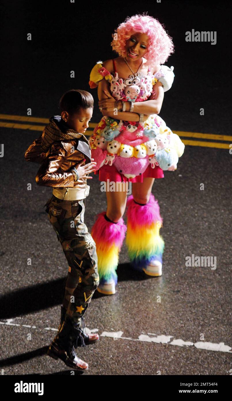 Wearing a pink wig, a stuffed animal-covered dress and rainbow-colored  fuzzy leg warmers, singer Nicki Minaj shoots a new music video on location  in downtown LA. Special guest stars Willow and Jaden