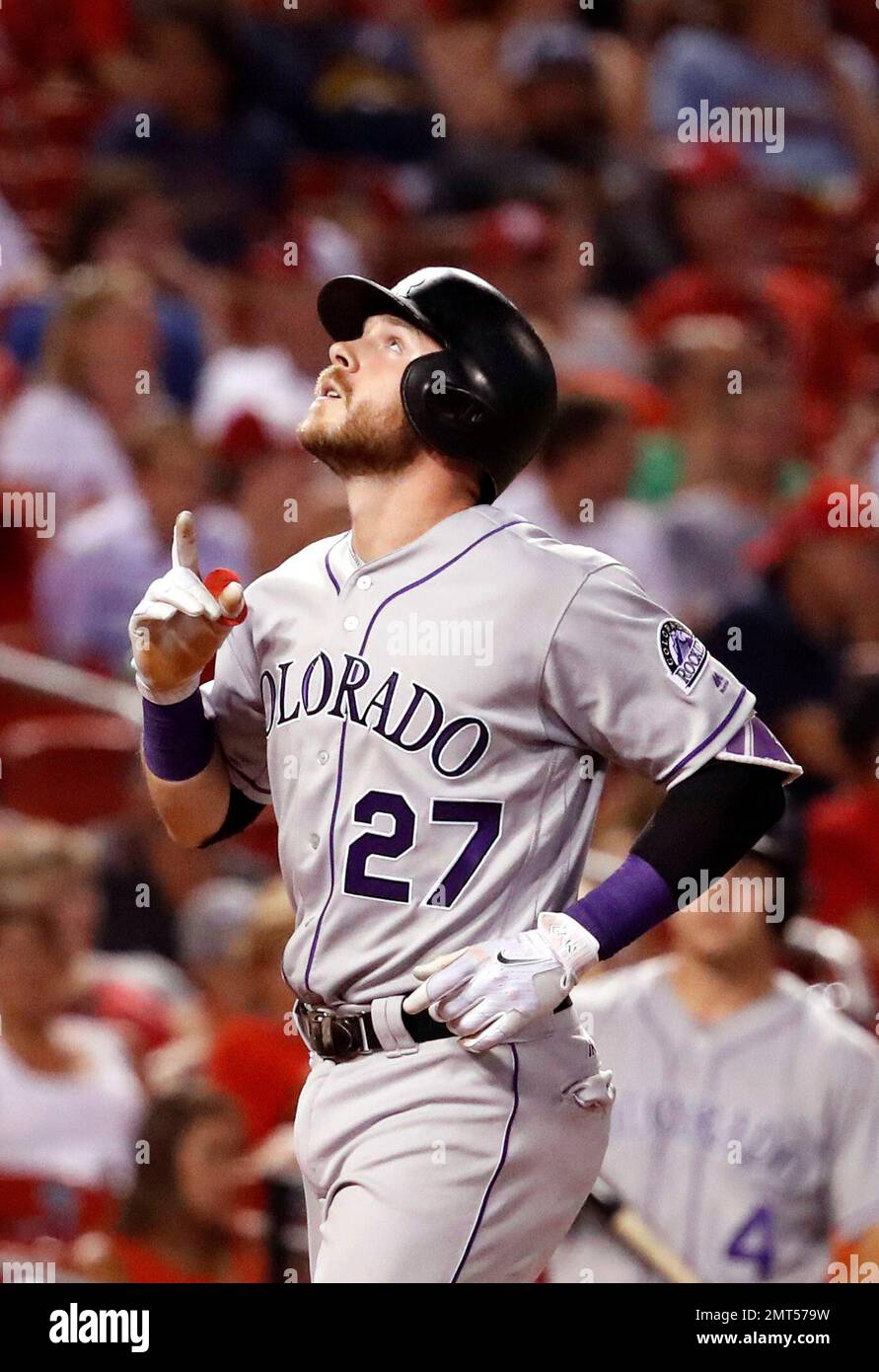 Colorado Rockies' Trevor Story looks skyward as he arrives home