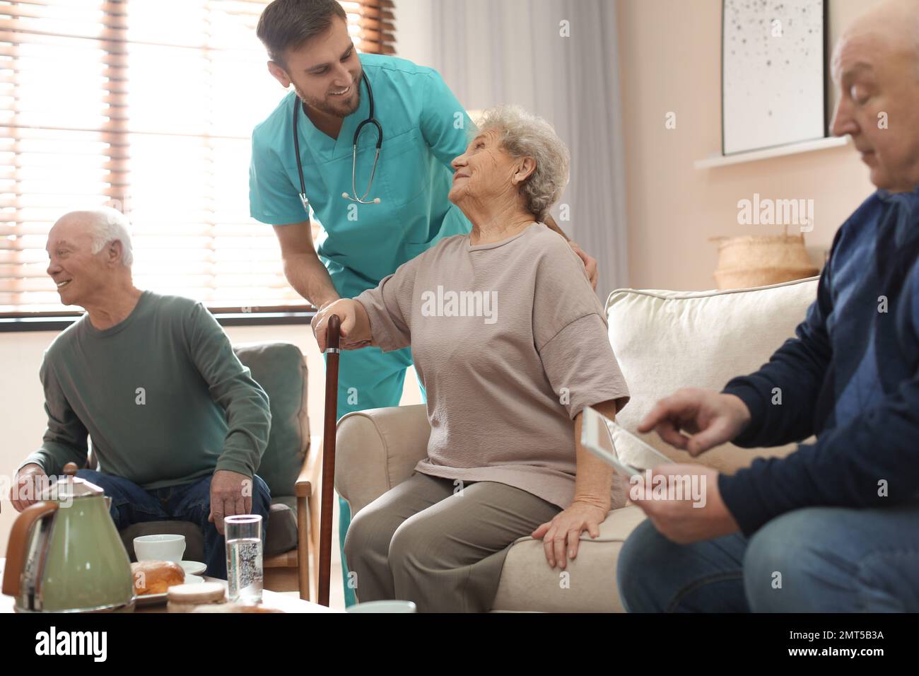 Medical worker taking care hi-res stock photography and images - Alamy