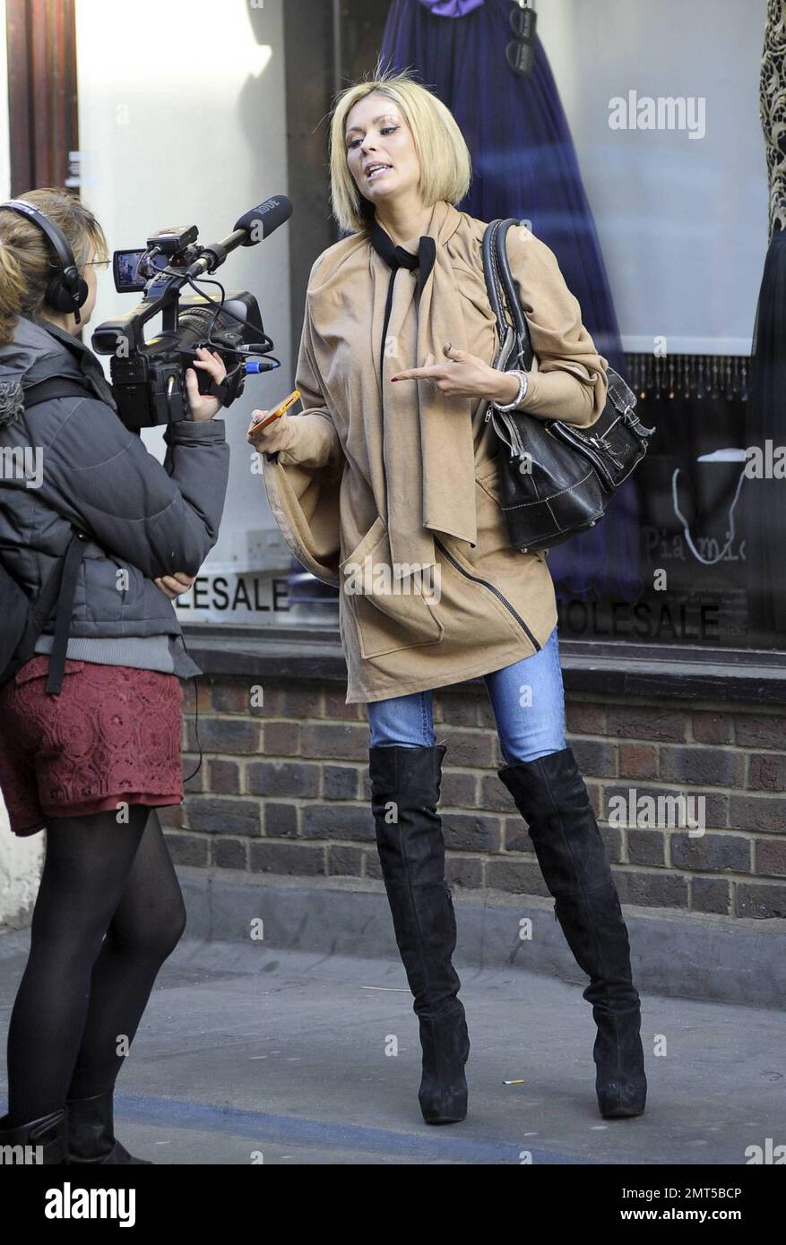 Model and WAG Nicola McLean films on the streets of London with a ...