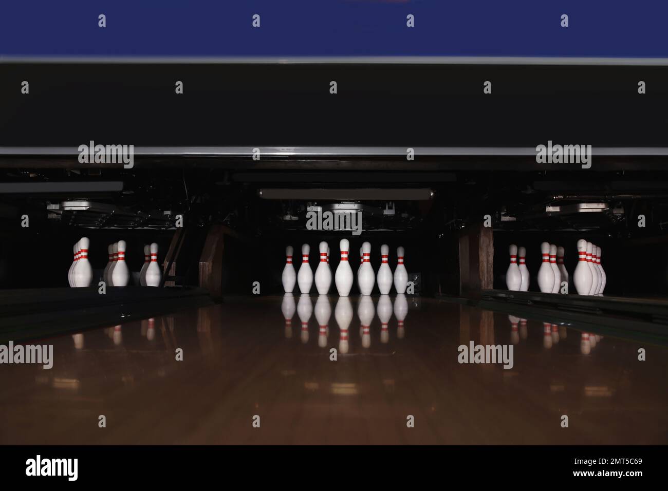 Bowling alley lanes with pins in club Stock Photo Alamy