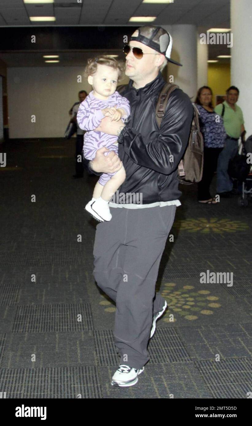 Nicole Richie and beau Joel Madden arrive with daughter Harlow at Miami ...