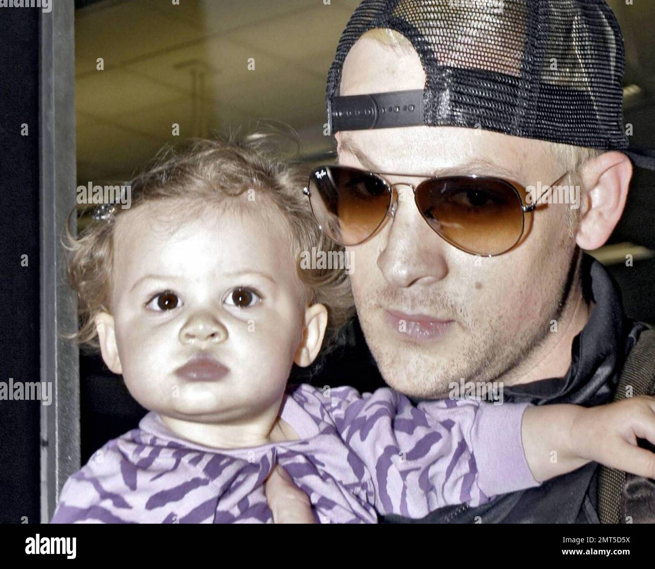 Nicole Richie and beau Joel Madden arrive with daughter Harlow at Miami ...