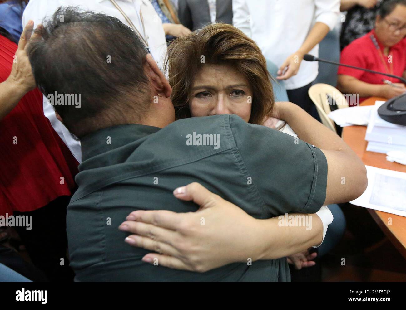 Ilocos Norte Governor Imee Marcos gets teary-eyed as she is hugged by her  provincial government employee who was released Tuesday after being cited  in contempt and detained for being evasive in their