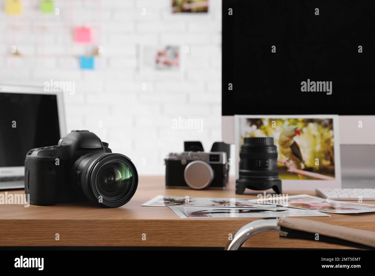 Photographer's workplace with professional camera in office Stock Photo ...
