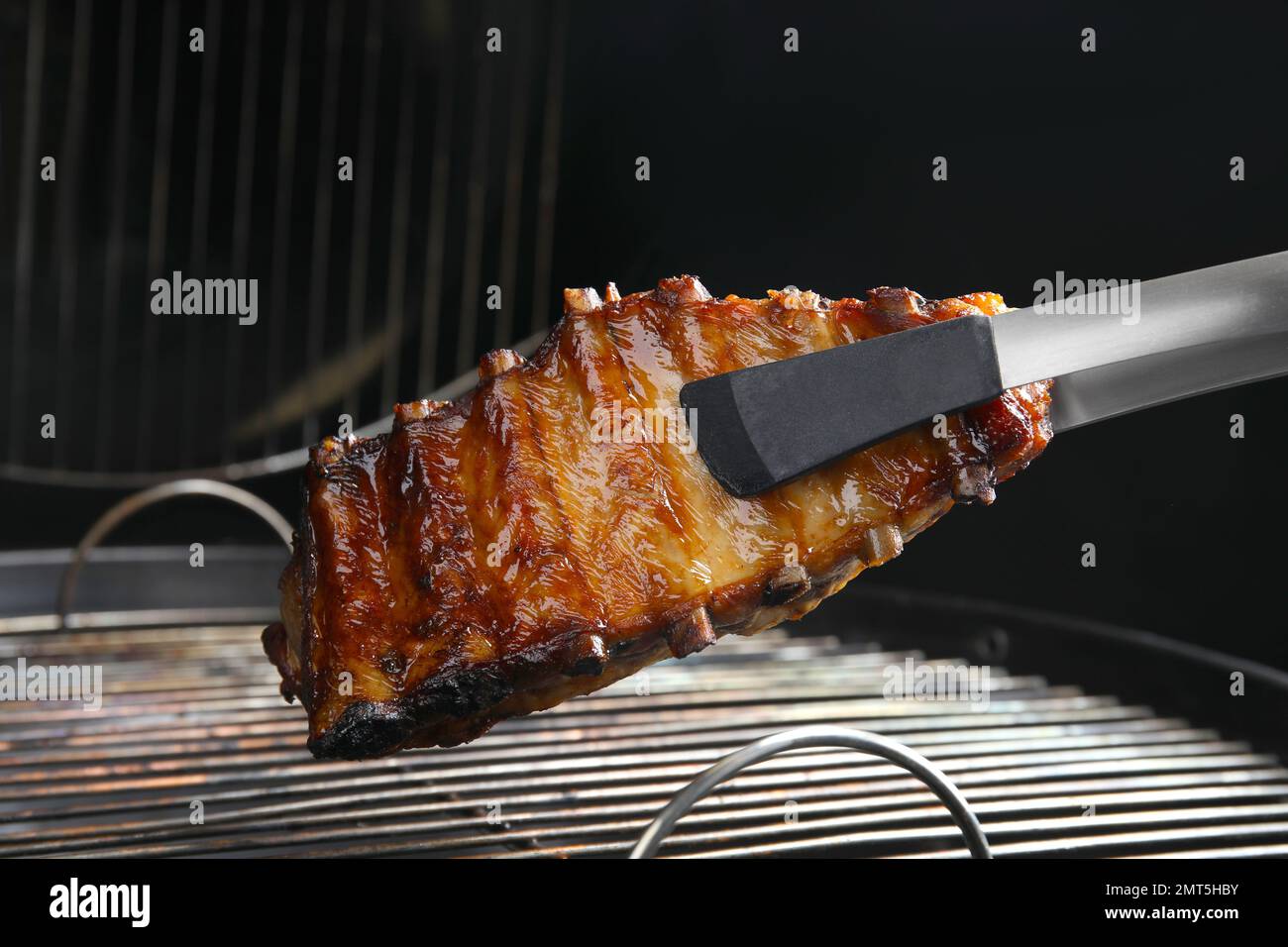 Delicious ribs on barbecue grill. Yummy meat Stock Photo Alamy