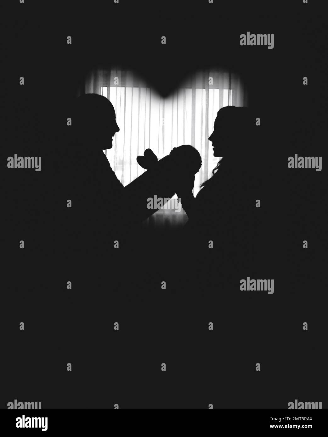 Silhouettes of happy parents, father and mother holding newborn baby by ...