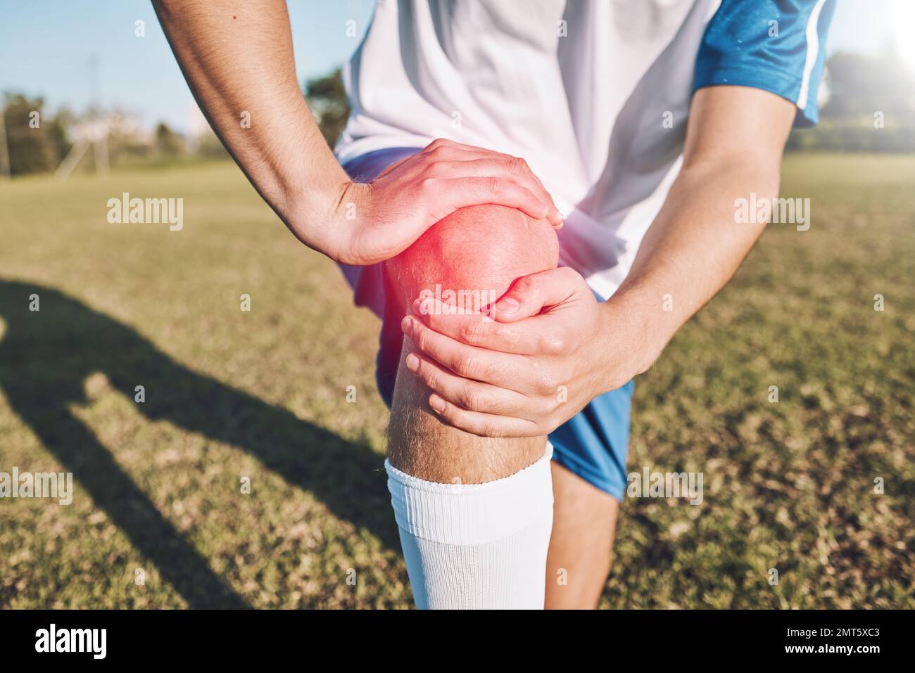 Sports, knee pain and hands on field or football competition, training